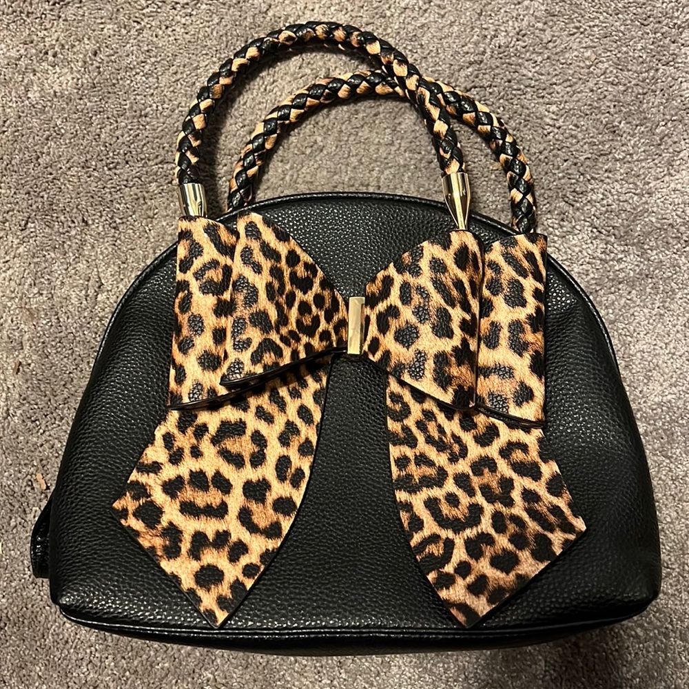 Medium black handbag, detachable strap, printed bow & liner, no stains or tears.